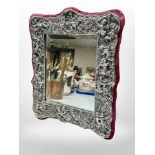 An ornate silvered Art Nouveau style easel mirror,