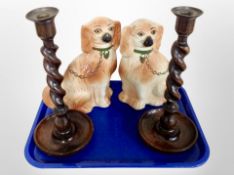 A pair of Staffordshire dogs and a pair of barley twist candlesticks,