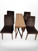 A 1970's teak drop leaf dining table and a set of four chairs