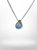 A 9ct gold on silver pendant with blue and clear cubic Zirconia