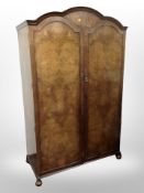 A Queen Anne style burr walnut double door wardrobe by Robsons of Newcastle,
