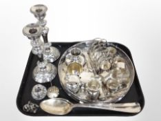 A silver plated gallery serving tray, napkin rings, toast rack, pair of candlesticks,