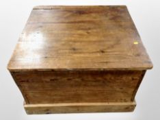 A 19th century stained pine storage low table,