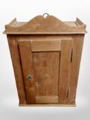 A late 19th century pine double door wall cabinet,
