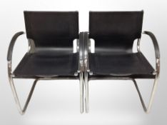 A pair of 20th century Danish chrome framed and black vinyl armchairs
