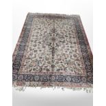 A machine made rug of Persian design 252 cm x 171 cm