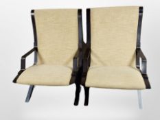 A pair of Danish Fritz Hansen stained and laminated wood armchairs in buttoned sand upholstery,