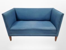 A 20th century Danish two seater salon settee in blue upholstery,