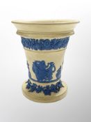 A Wedgwood cane ware vase, decorated in relief, depicting classical figures, impressed mark beneath,