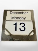 A silver mounted desk calendar by Carrs of Sheffield,