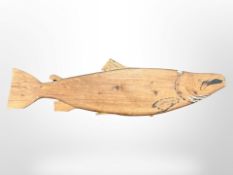 A carved pine salmon sign,