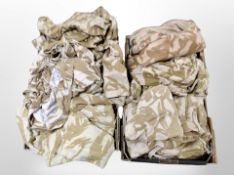 Two boxes of desert camouflage trousers etc
