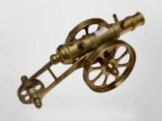A brass model of a cannon,