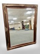 A Victorian style bevelled overmantel mirror in bronzed frame 123 cm x 97 cm