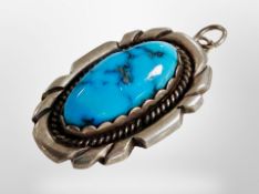 A silver turquoise pendant