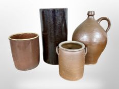 A Continental cylindrical glazed earthenware pot, wine jug and two further vessels,