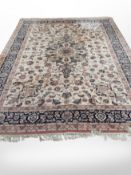 A machine made carpet of Persian design 374 cm x 273 cm