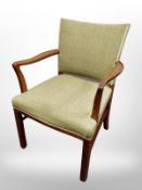 A 20th century Danish armchair in green upholstery