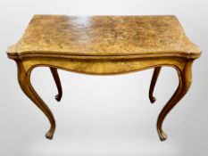 A 19th century Danish burr walnut serpentine fronted turn over top tea table on cabriole legs,