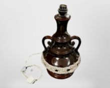 A glazed earthenware twin handled lamp base,