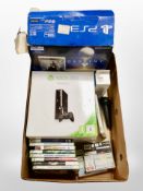A box of X-box 360 and PS3 consoles in boxes with assorted games,