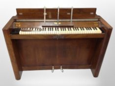 An Eavestaff mini piano in walnut case,