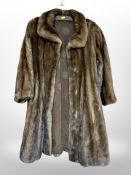 A lady's brown mink three quarter length coat