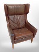A late 20th century Danish brown leather wingback armchair