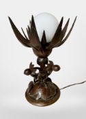 An Oriental carved lotus flower lamp with opaque glass shade,