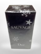 A bottle of Dior Sauvage Eau de toilette 100ml, sealed in cellophane wrapping.