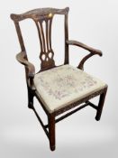 An Edwardian carved armchair in the Chinese Chippendale style with tapestry drop-in seat