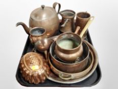 A group of copper kitchenailia including teapot, measuring jugs,