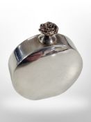 A silver perfume bottle