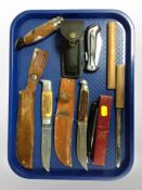 A group of antler handled hunting knives, cut throat razor,