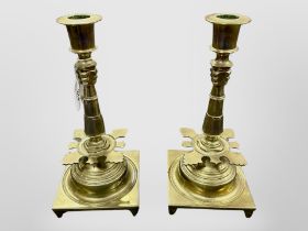 A pair of brass candlesticks,