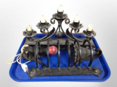 A wrought iron five sconce candle holder and further wall light