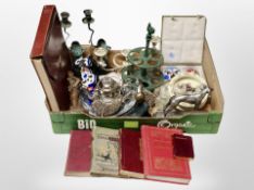 A box of metal candelabrum, ornaments, figures,