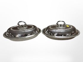 A pair of silver plated entrée dishes with lids,