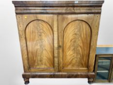 A Victorian mahogany bookcase, on bun feet,