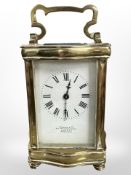 An early twentieth century brass carriage clock by Stewart and Co with key.