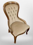 A Victorian style mahogany nursing chair