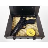 A Webley Tempest 22 calibre air pistol in metal case with tin of pellets.