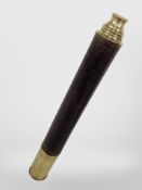 A brass and leather telescope.
