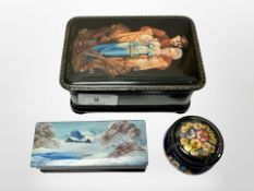 Three Russian hand-painted lacquer boxes, largest 13cm wide.