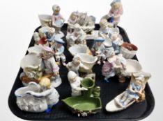 A group of Bavarian porcelain figurines and spill vases.