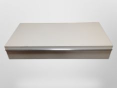 A contemporary white gloss low storage table,
