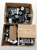 Two boxes of assorted vintage cameras including Kodak, a Eumig projector, etc.