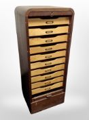 An early 20th century oak shutter front office index cabinet, with working key,
