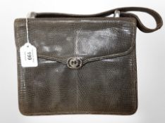Gucci : A lady's handbag, circa 1970's, green leather, finished in the snakeskin style,
