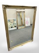 A gilt-framed overmantel mirror, 106cm x 136cm.